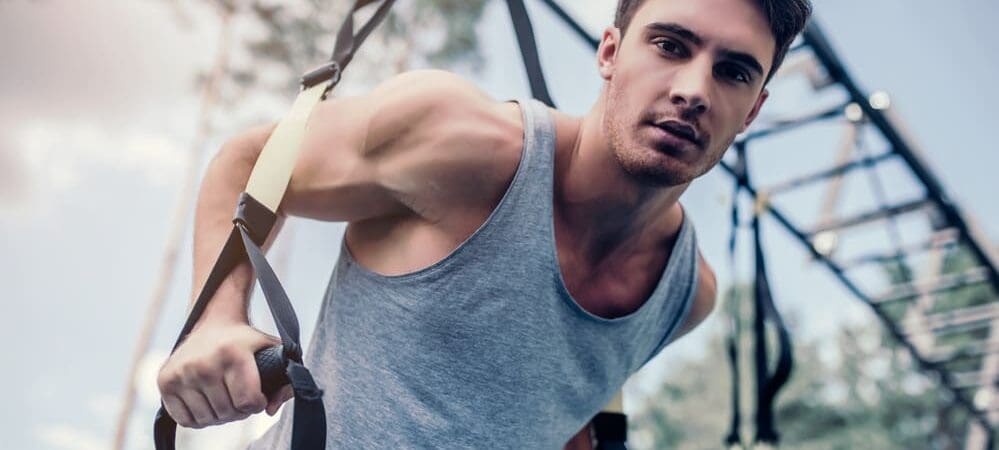 Man training with TRX gay mens therapy chicago