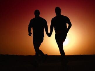 Two people holding hands representing authentic connection in therapy