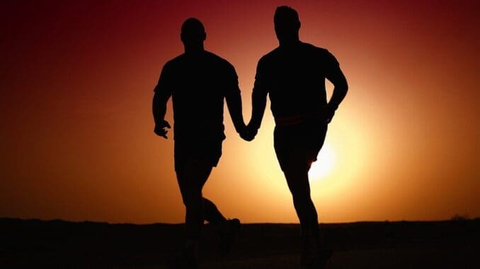 Two people holding hands representing authentic connection in therapy