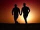 Two people holding hands representing authentic connection in therapy