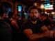gay man with depression sitting at a bar in Chicago & thinking of therapy with 2nd Story Counseling