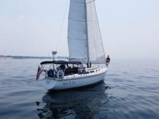successful man on sailboat lake michigan
